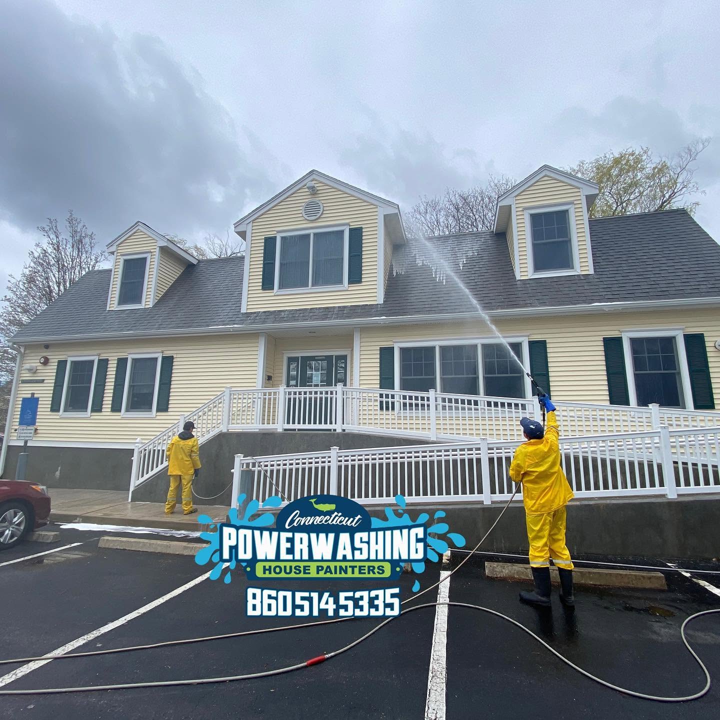 Connecticut House Painters crew power washing a commercial building exterior